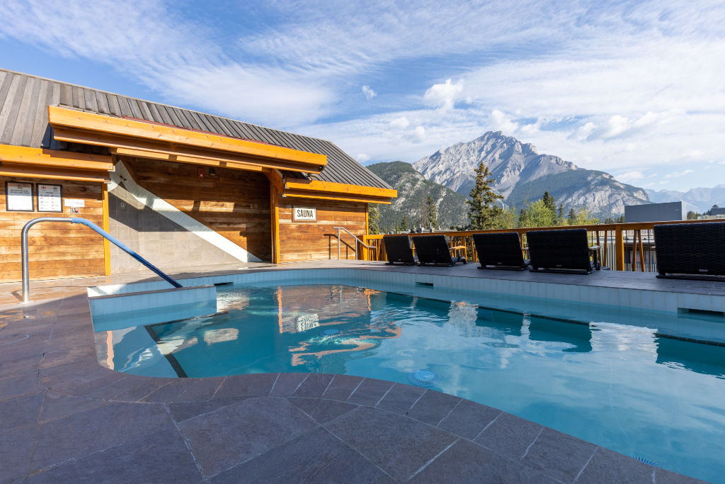 image Luxuriate in our outdoor pool, framed by stunning mountain panoramas, for an unforgettable swim.