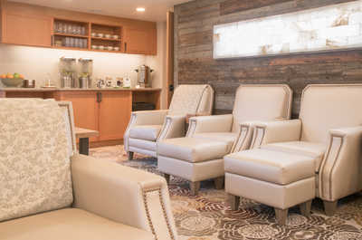Lounge in comfort in our chic, serene spa waiting area.