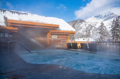 Warm up in our steamy outdoor hot tub while savoring the snowy mountain views.