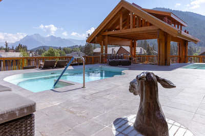 Enjoy panoramic mountain vistas from our serene pool.