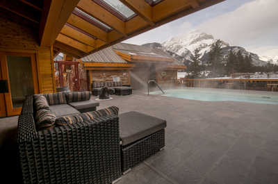 Cozy up in this inviting outdoor lounge area, with the mountains as your backdrop.