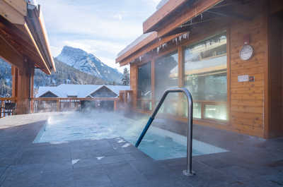 Immerse yourself in the warmth of our outdoor pool, steps away from the frosty air and alpine beauty.