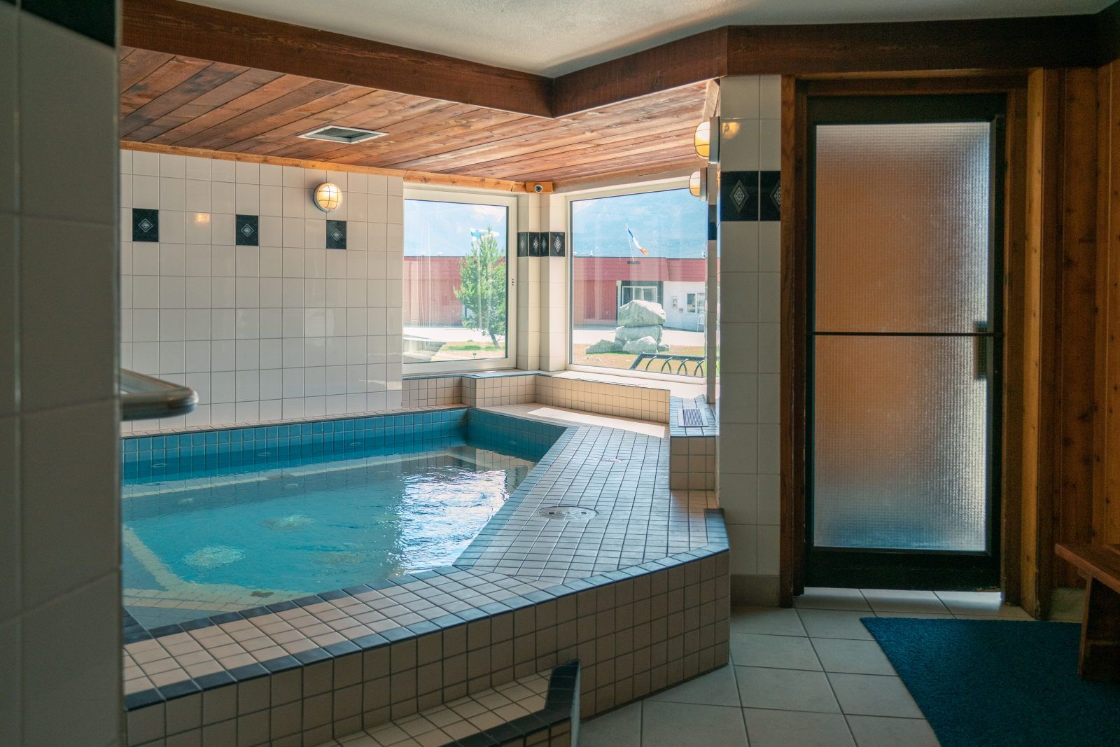 image Indoor hot tub with open mountain views — a good reason to stay an extra night