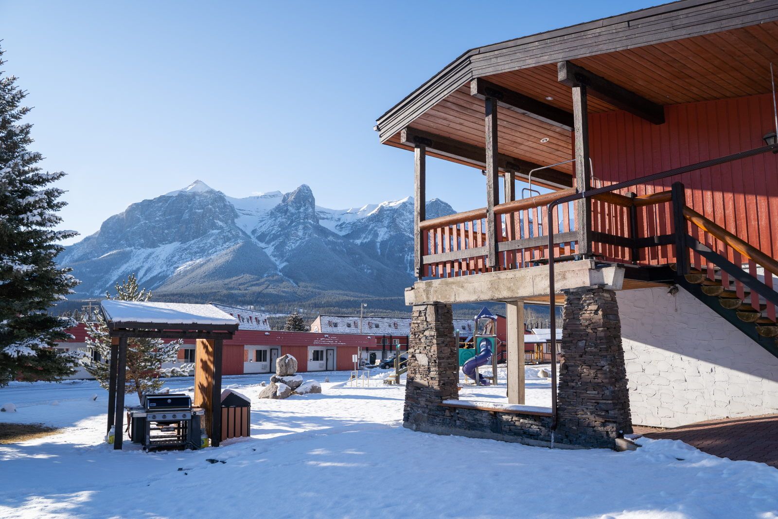 image Colourful lodge exterior facing the mountains — complimentary parking right out front