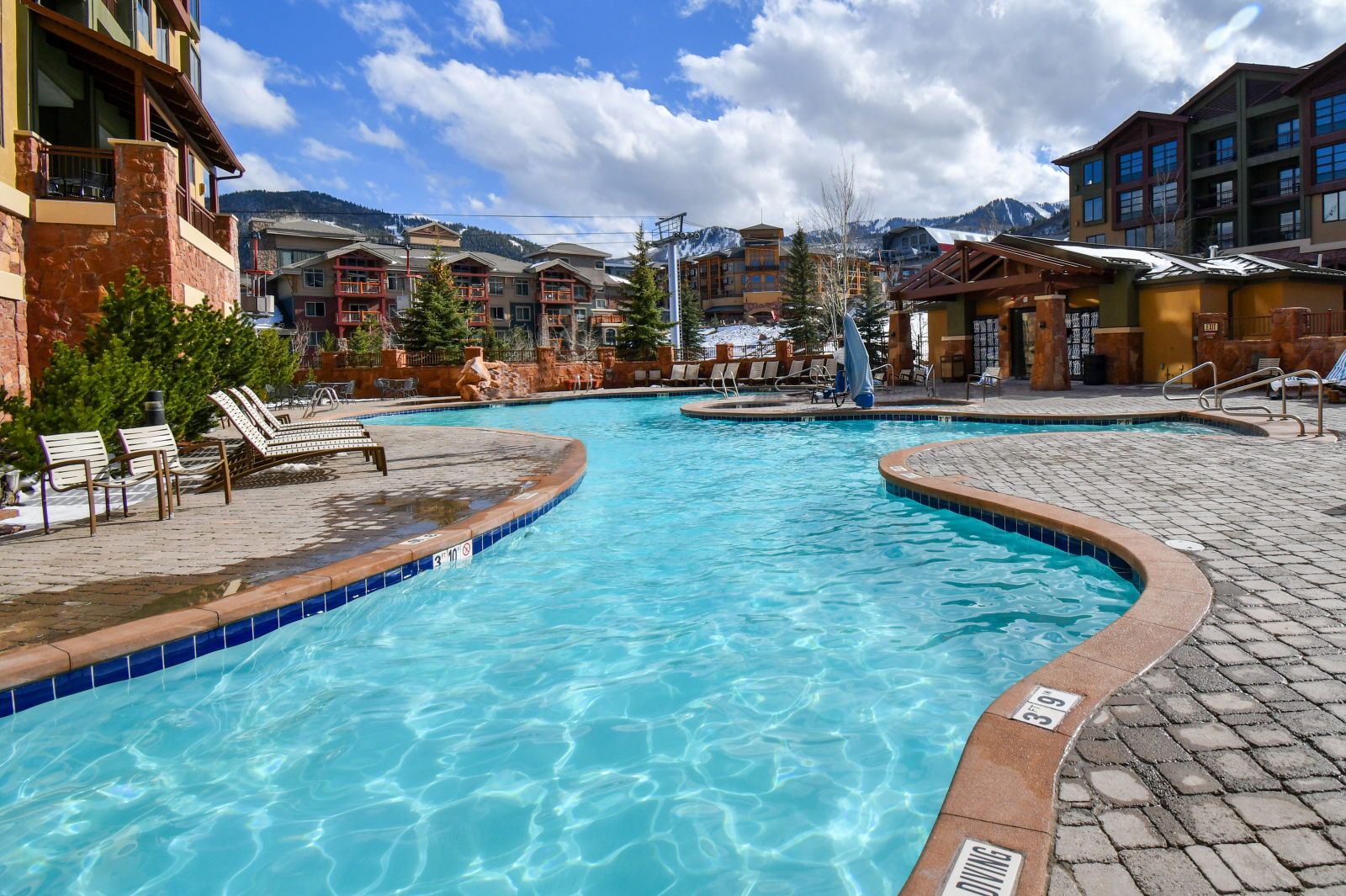 image Dive into relaxation in the shimmering pool, surrounded by stunning mountain views.