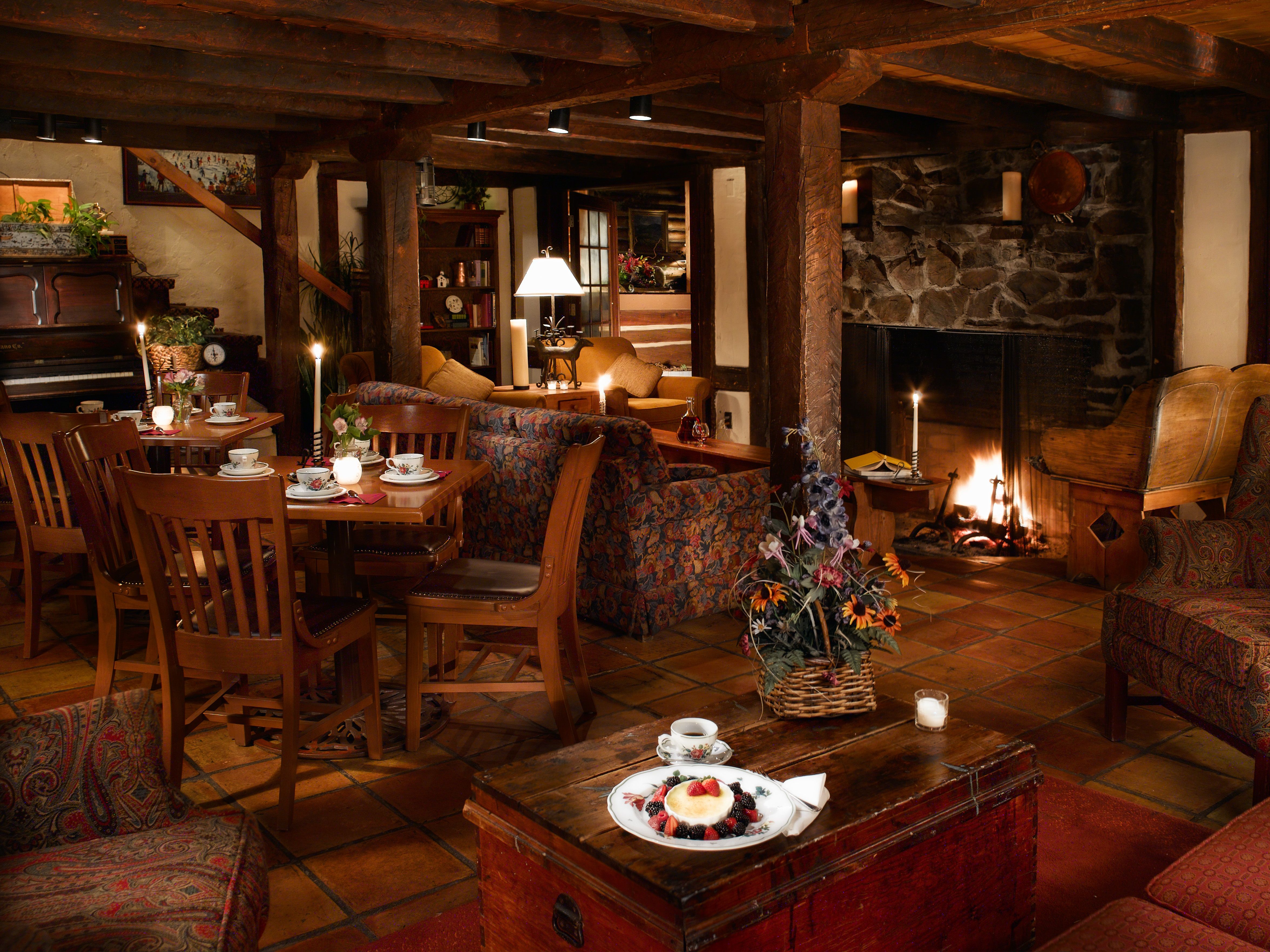 image An intimate dining experience awaits in a softly lit restaurant, where warm wooden accents create a welcoming atmosphere.