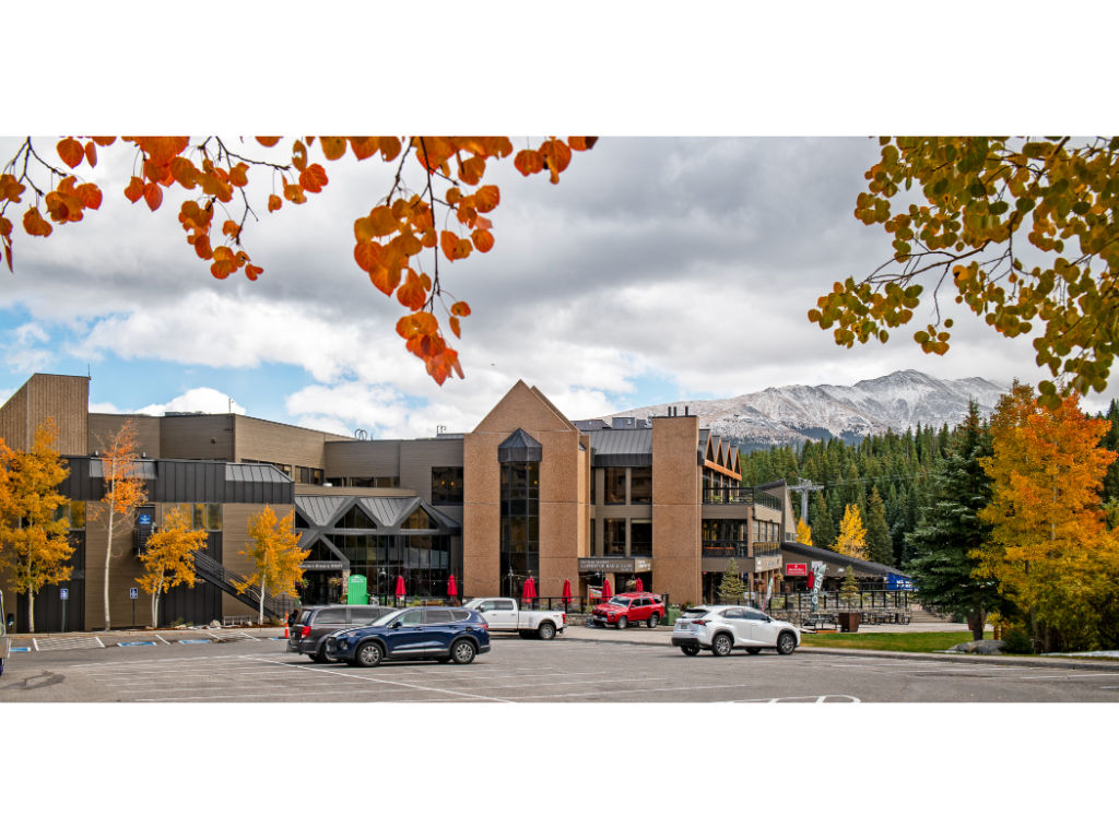 image Majestic autumn hues frame Beaver Run Resort, highlighting the harmonious blend of luxurious accommodations and natural splendor.