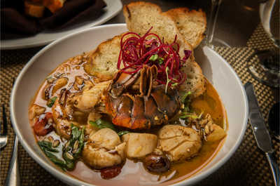  Our delectable entrée pairs golden-crusted fish with a side of seasonal greens, marrying health with flavor.