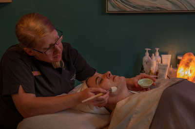 Indulge in a facial treatment that promises to rejuvenate both your skin and spirit, all in the glow of soothing ambiance.