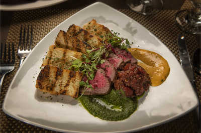 A masterpiece of flavors with our herb-crusted steak, perfectly seared to your liking.