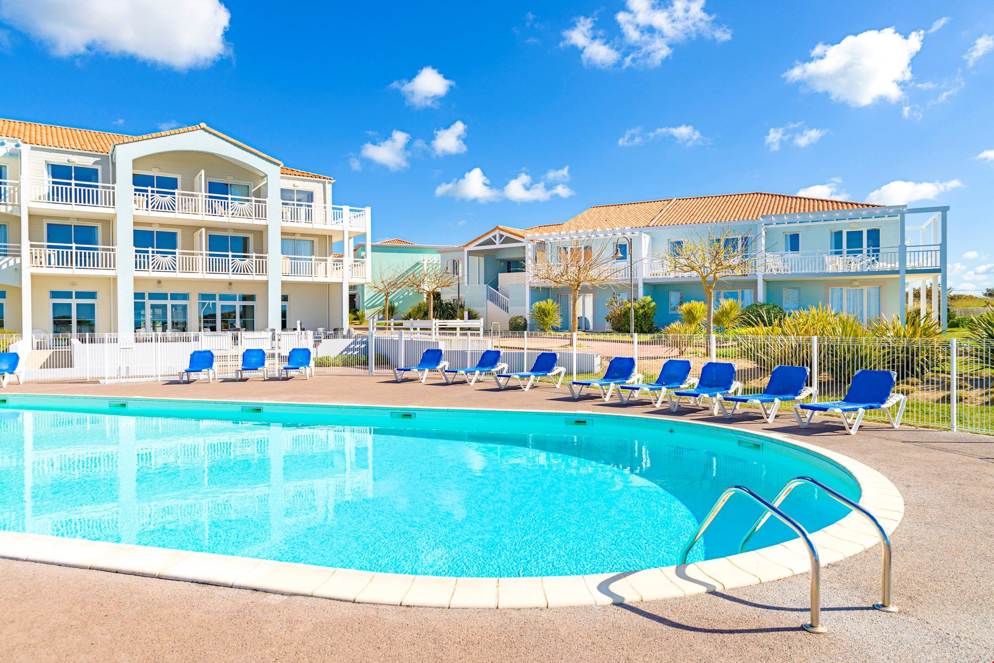 image Take a seat by the pool and lounge under the sun during the summer months.