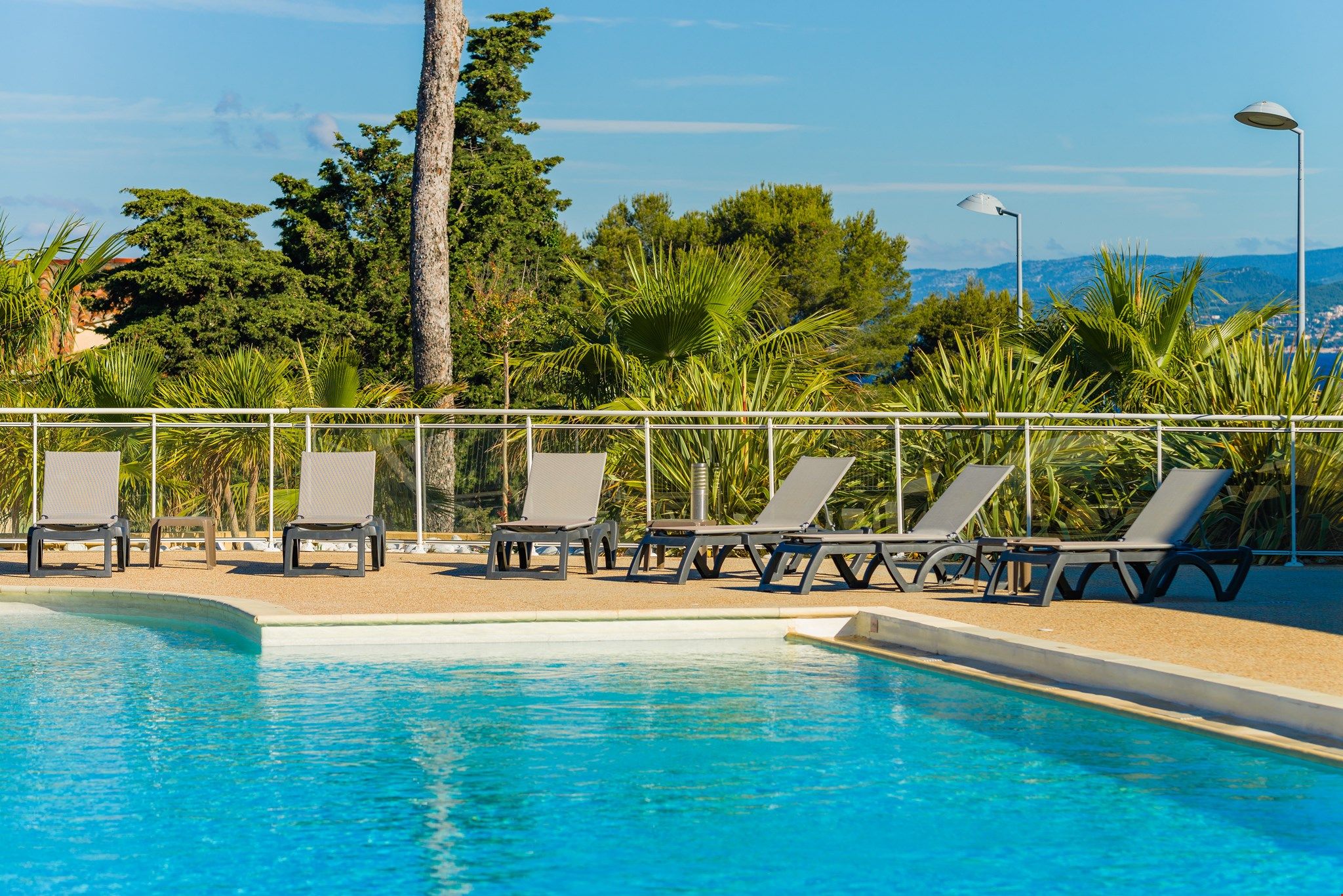image Relax and unwind around the seasonal outdoor pool.