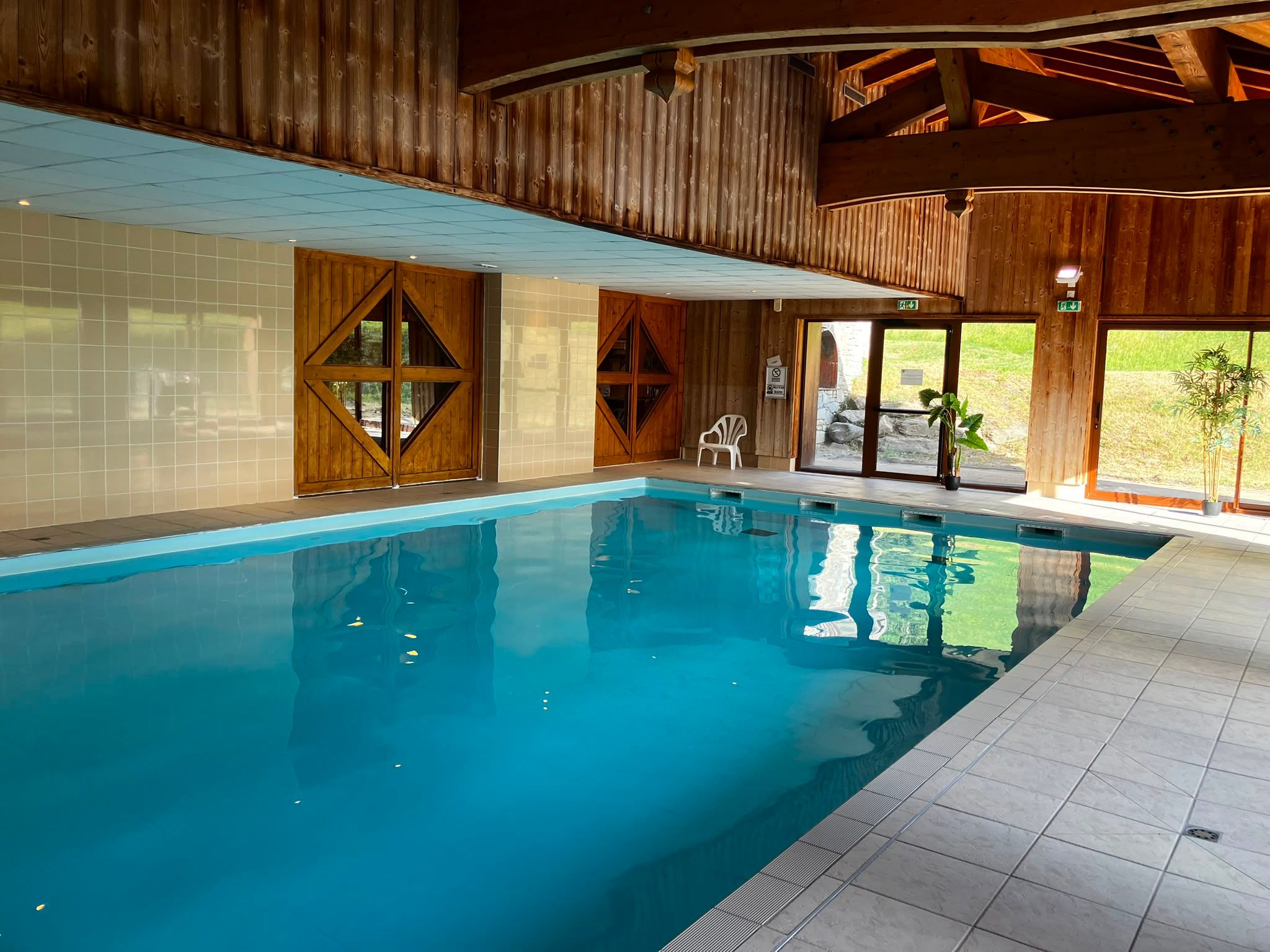 image Take a dip in the indoor pool, lit with natural light and wrapped in warm wood accents