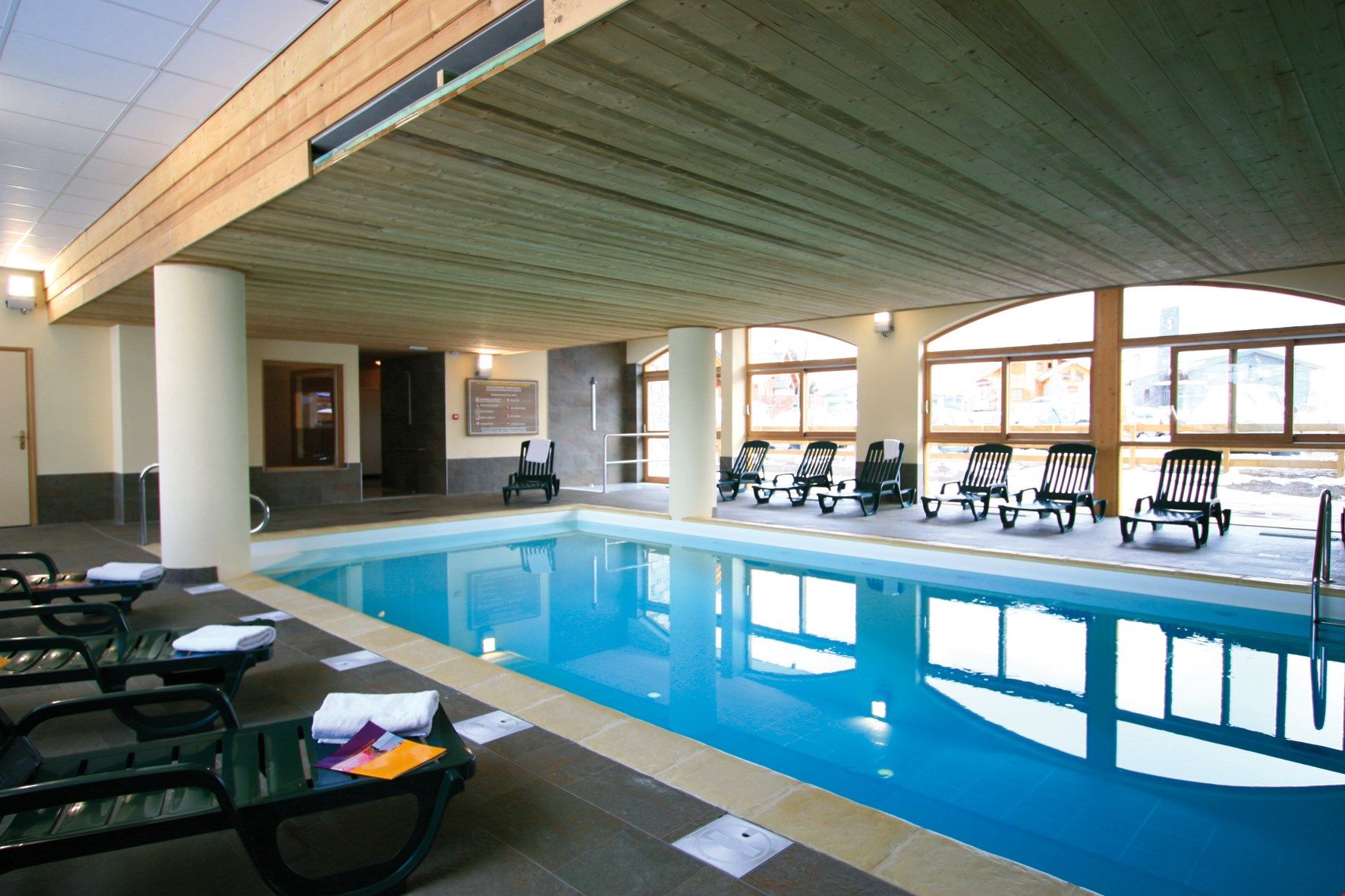 image Relax in the indoor heated swimming pool and whirlpool.