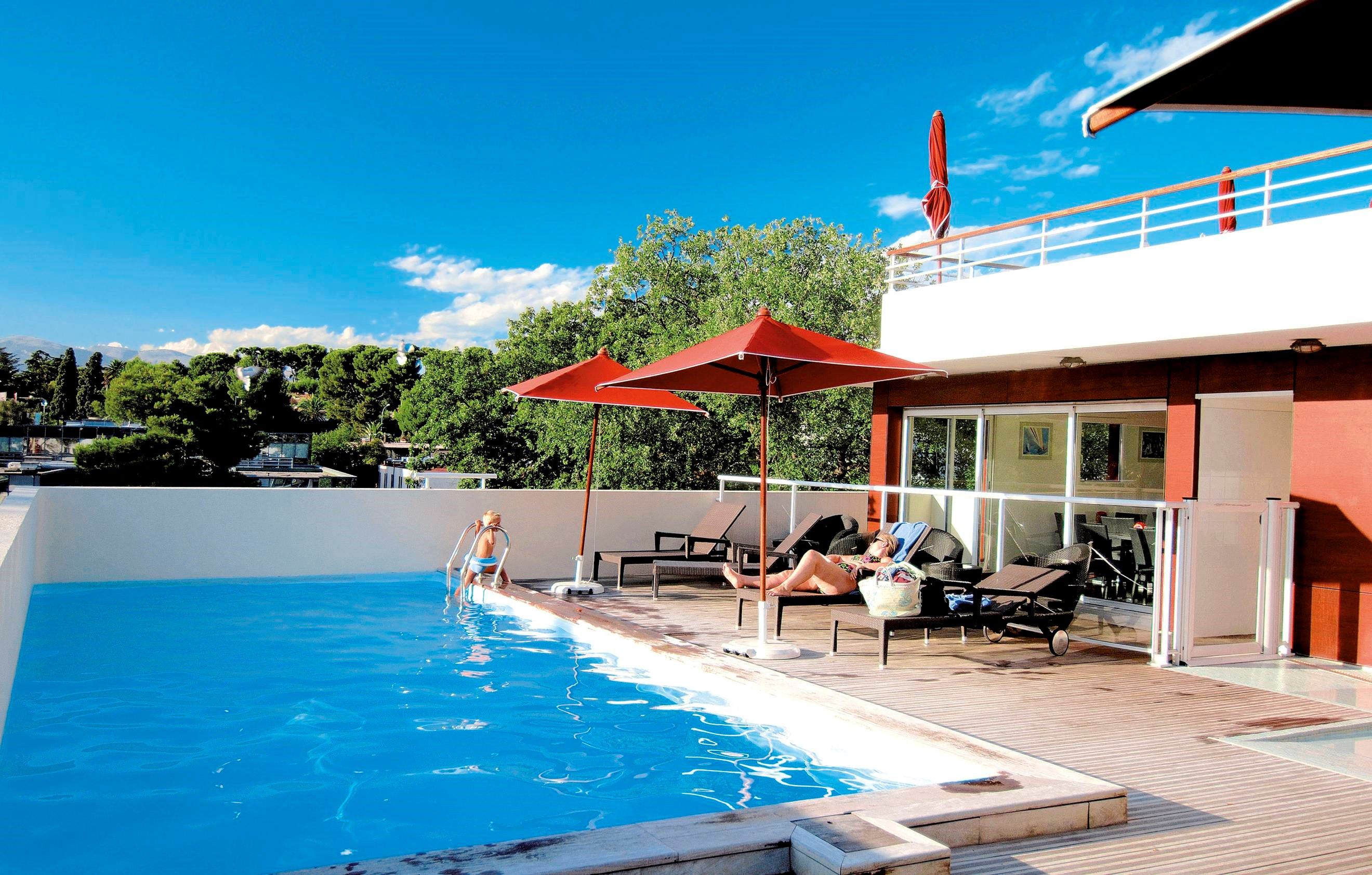 image Take in gorgeous views while lounging around the on-site outdoor pool.