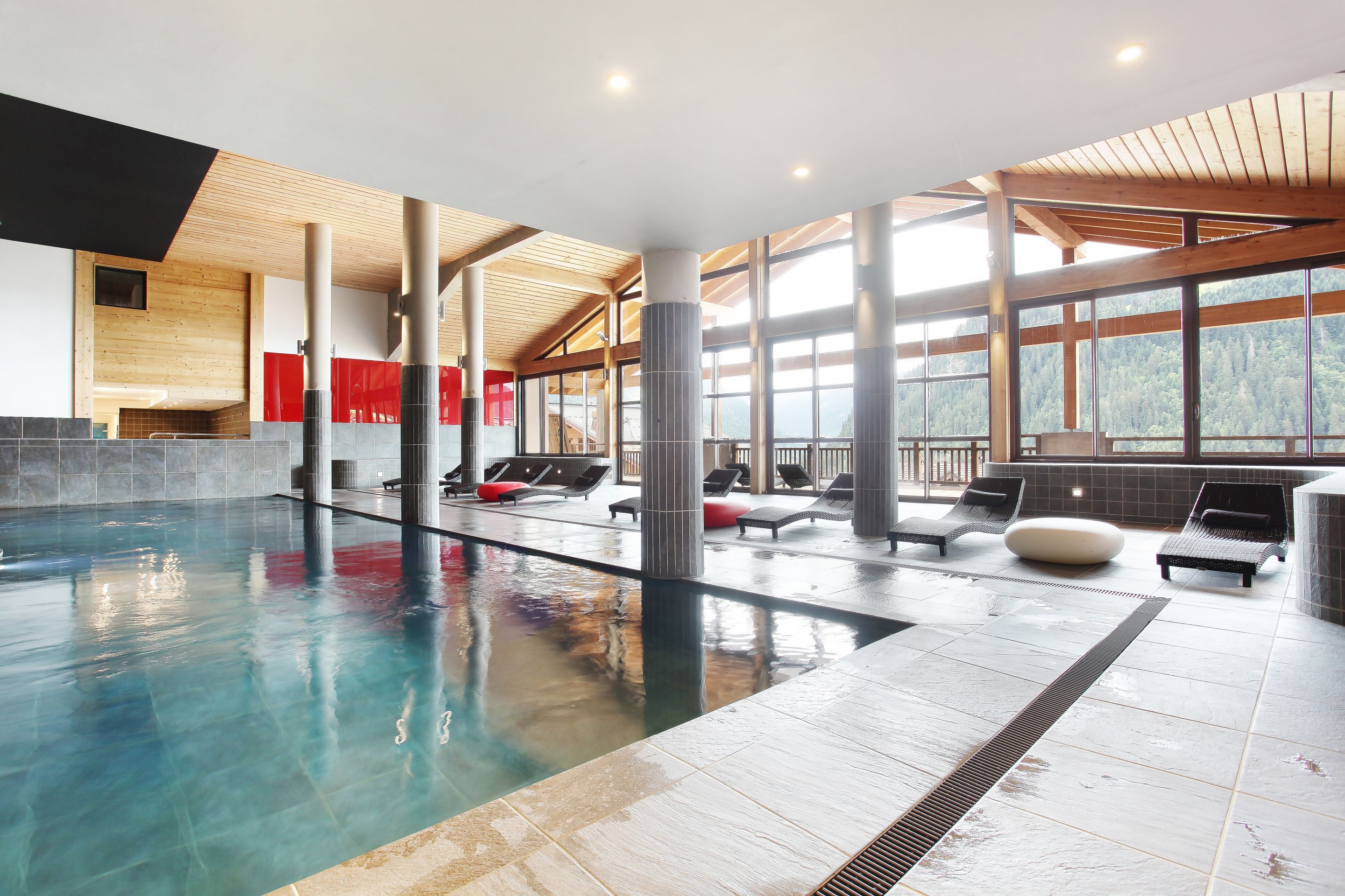image The indoor pool catches the light from the surrounding Alpine peaks — open December to April for guests looking to recover between ski days.