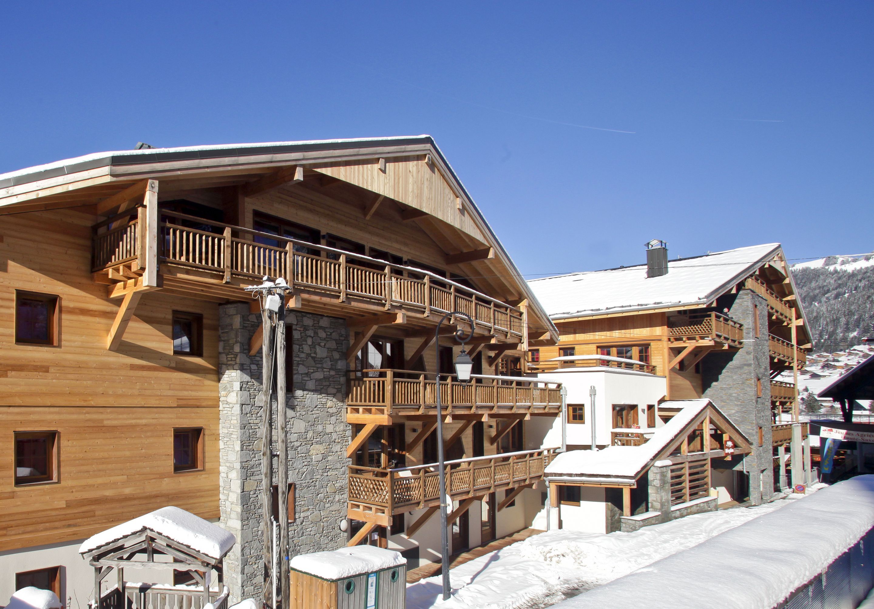image Built in traditional Savoyard stone and timber, the residence blends into Châtel village while keeping the slopes just steps away.