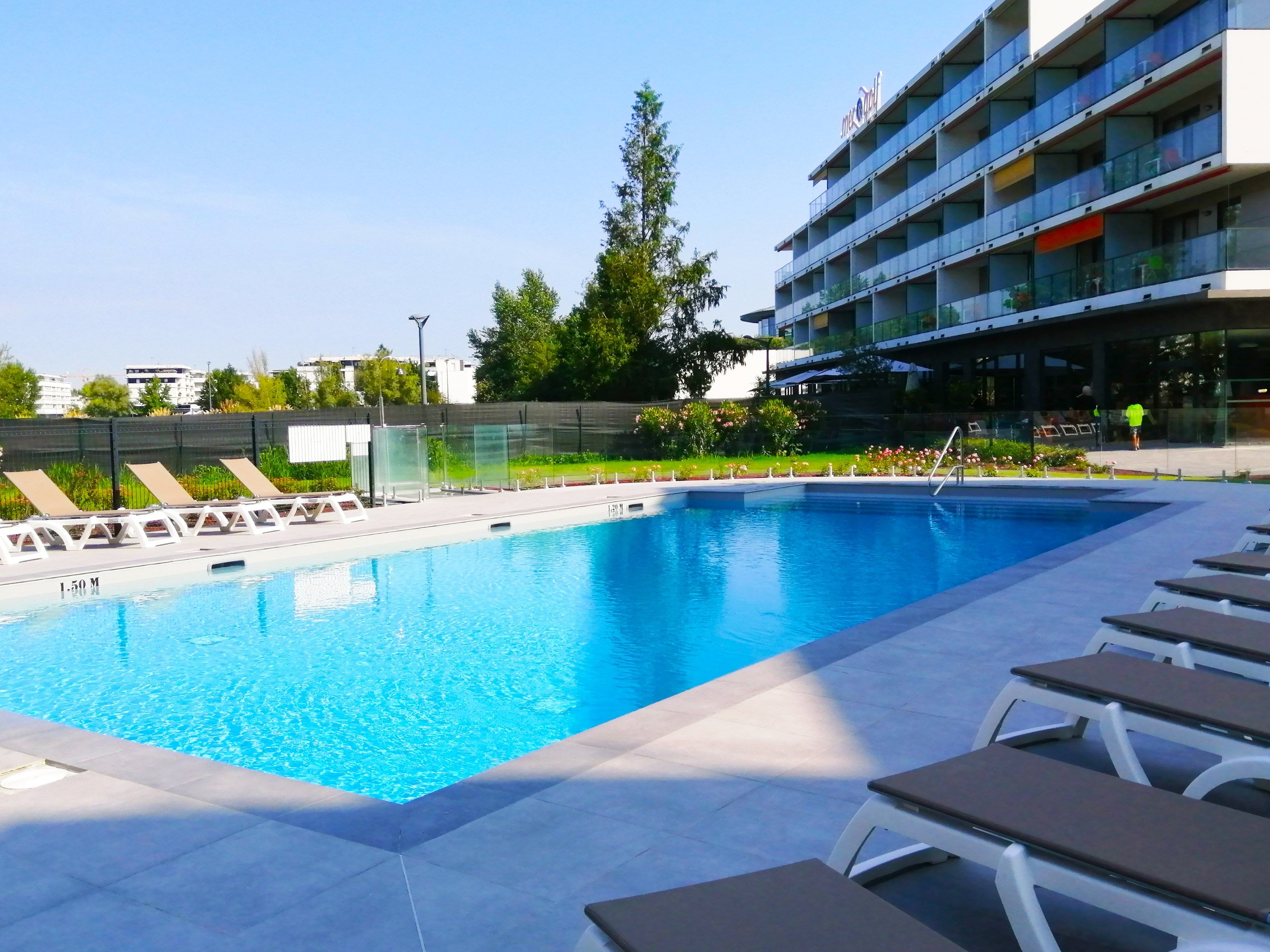 image Lounge by the pool in the sunshine.