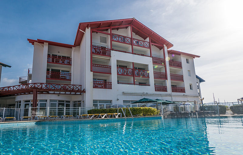 image Relax and unwind in the sparkling outdoor swimming pool.