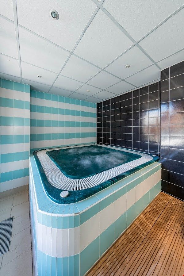 image Soak sore muscles in the indoor hot tub on-site.