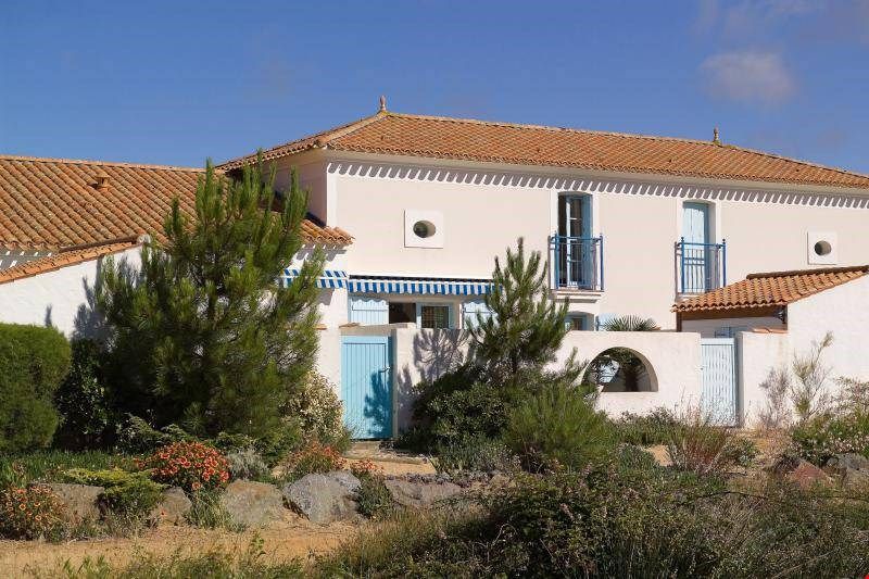 image Feel right at home in these classic French houses - featuring white walls and orange roofs.