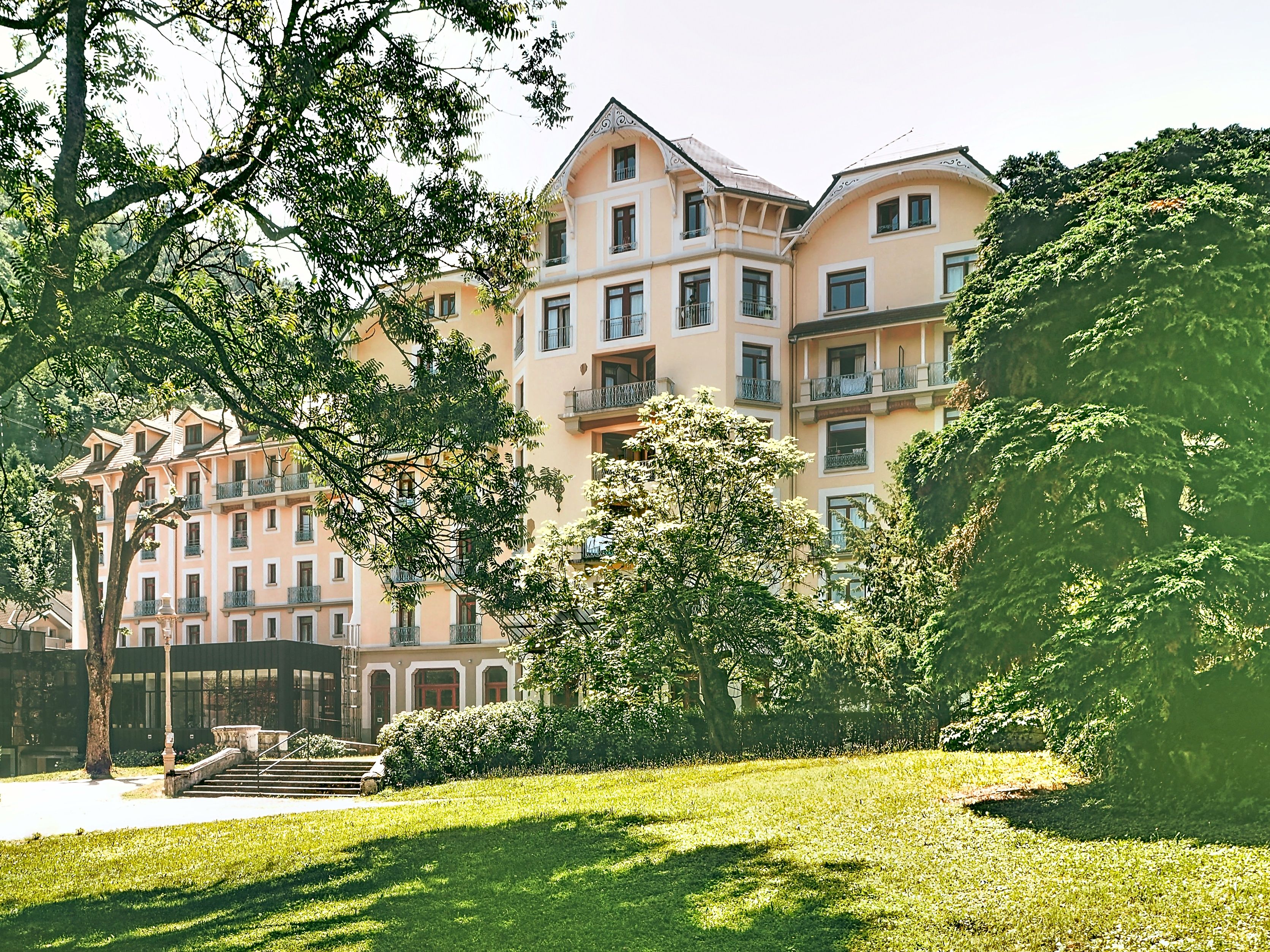 image Building surrounded by lawns, a short walk from the thermal spa.