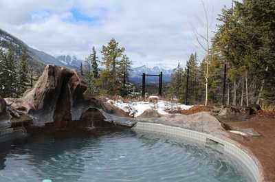 Featuring lovely, natural decor, this hot pool will have you feeling immersed in the beauty of the Rockies!