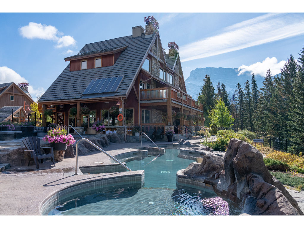 image Relax in the crystal-clear hot pools at Hidden Ridge Resort in Banff, surrounded by majestic nature.