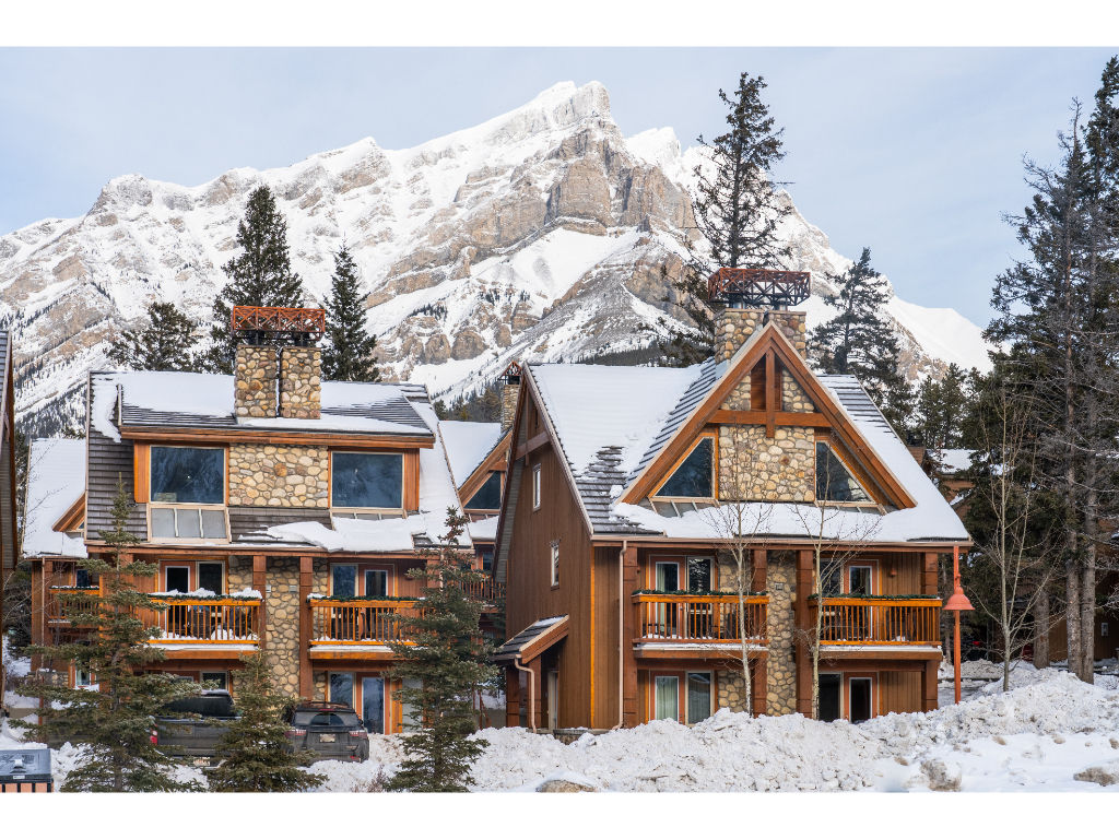 image Snow-covered beauty surrounds the inviting lodges of Hidden Ridge Resort.