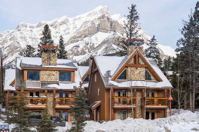 Snow-covered beauty surrounds the inviting lodges of Hidden Ridge Resort.