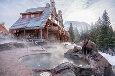 Take in the breathtaking mountain views while soaking in the serene hot pools.