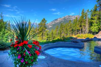 Soak in the SHARED hot pools while you take in incredible views of the mountains