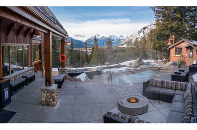 Embrace winter warmth at Hidden Ridge Resort in Banff, with hot pools and cozy surroundings.