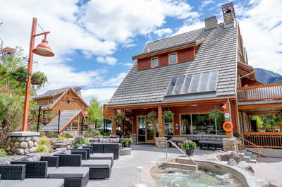 Cozy up by the fire at Hidden Ridge Resort in Banff, where rustic charm meets modern comfort.