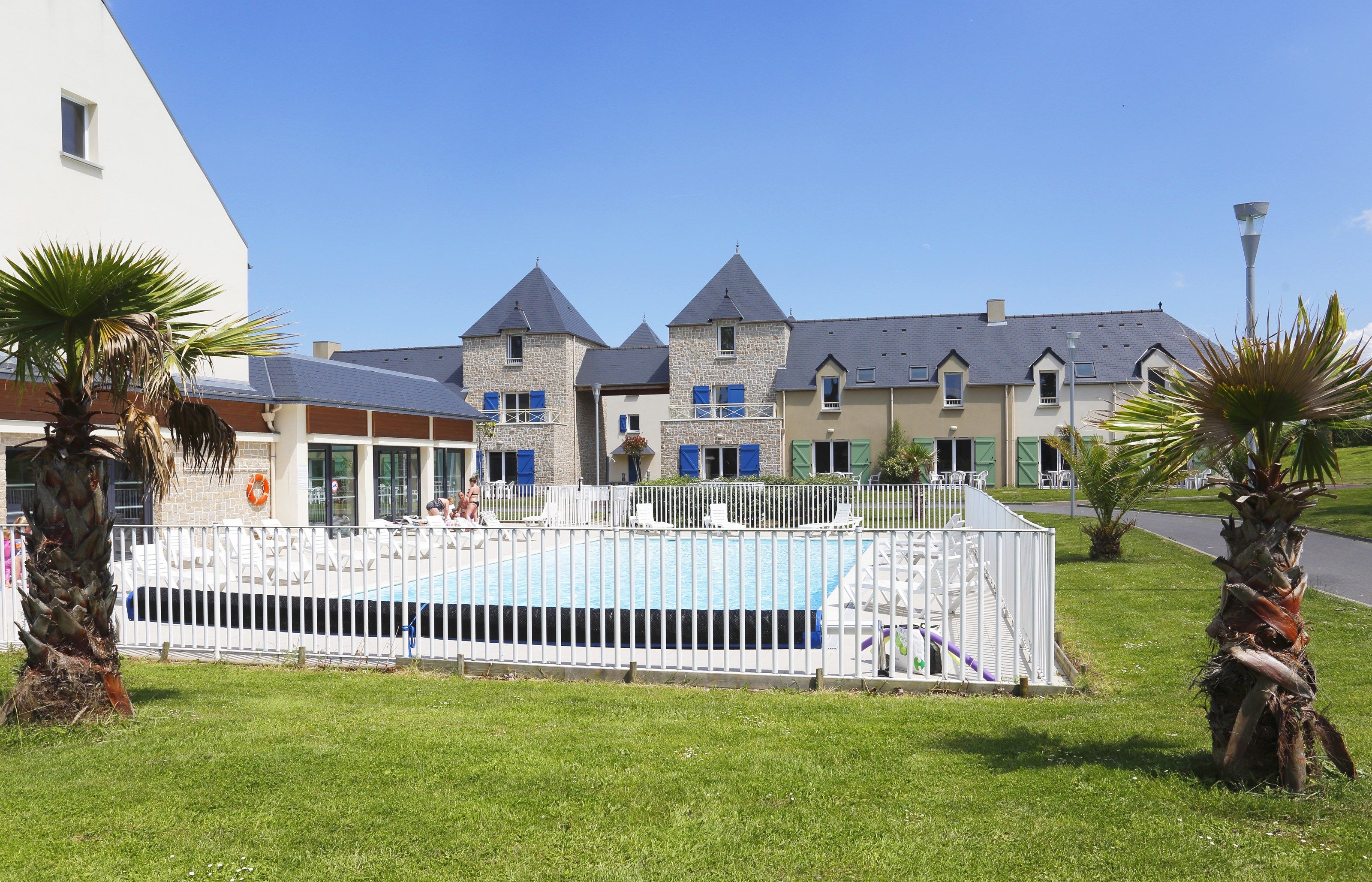 image You will love to dive into the pristine outdoor pool on a hot summer day.