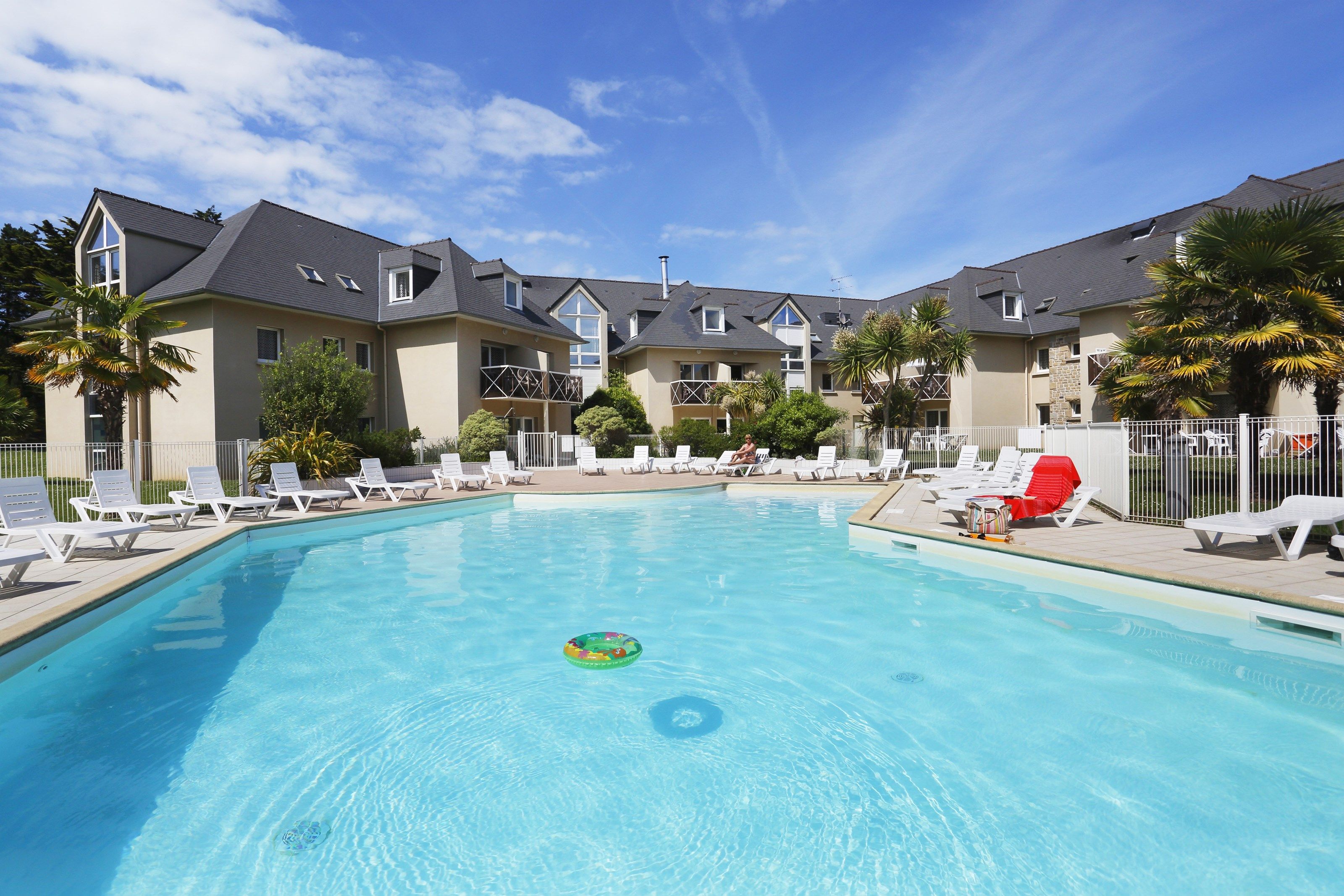 image Dive into the pristine outdoor pool in the summer.