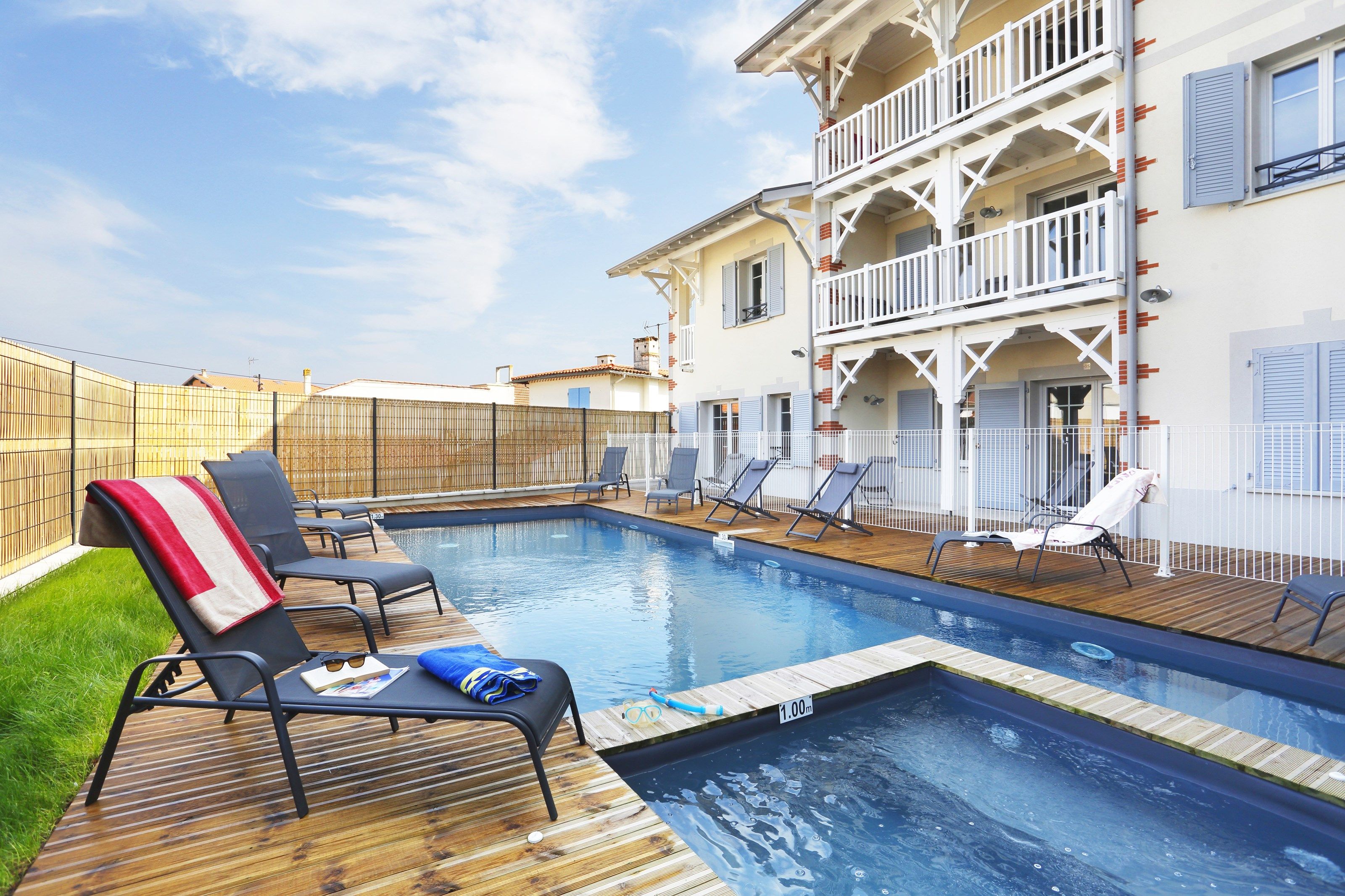 image Come and dive into this outdoor pool after a wonderful day.