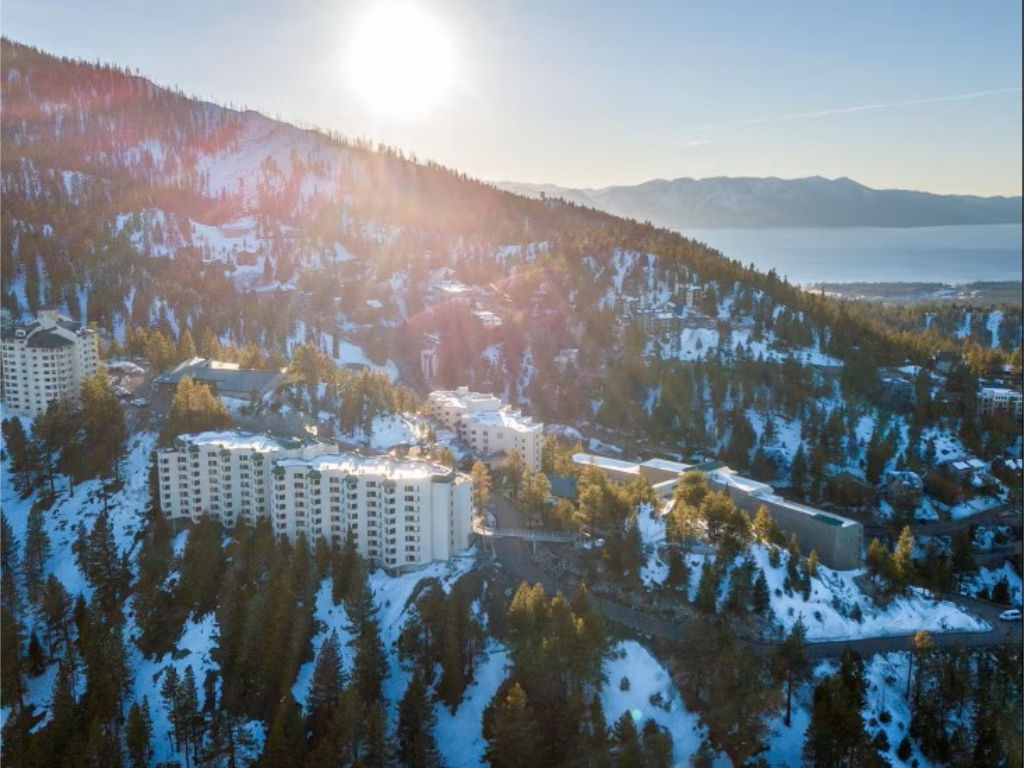 image Wake up to stunning views of rolling hills and a sparkling lake kissed by sunlight.