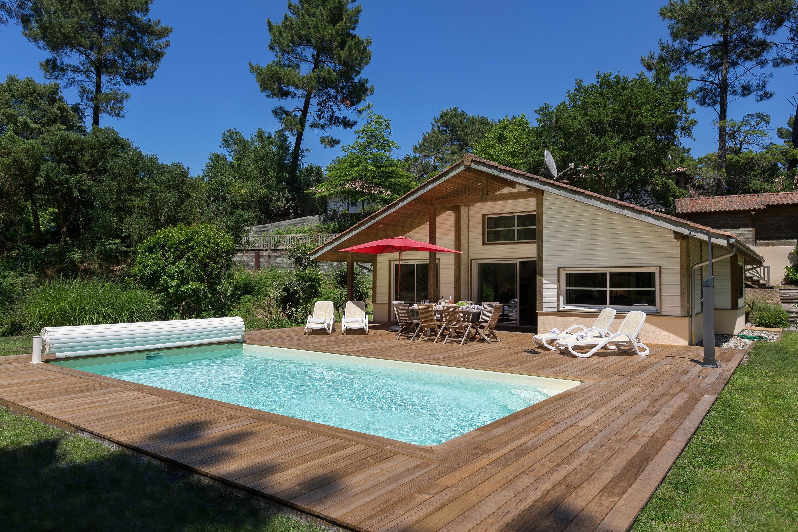 image Dive into the gorgeous outdoor pool on a hot summer day.