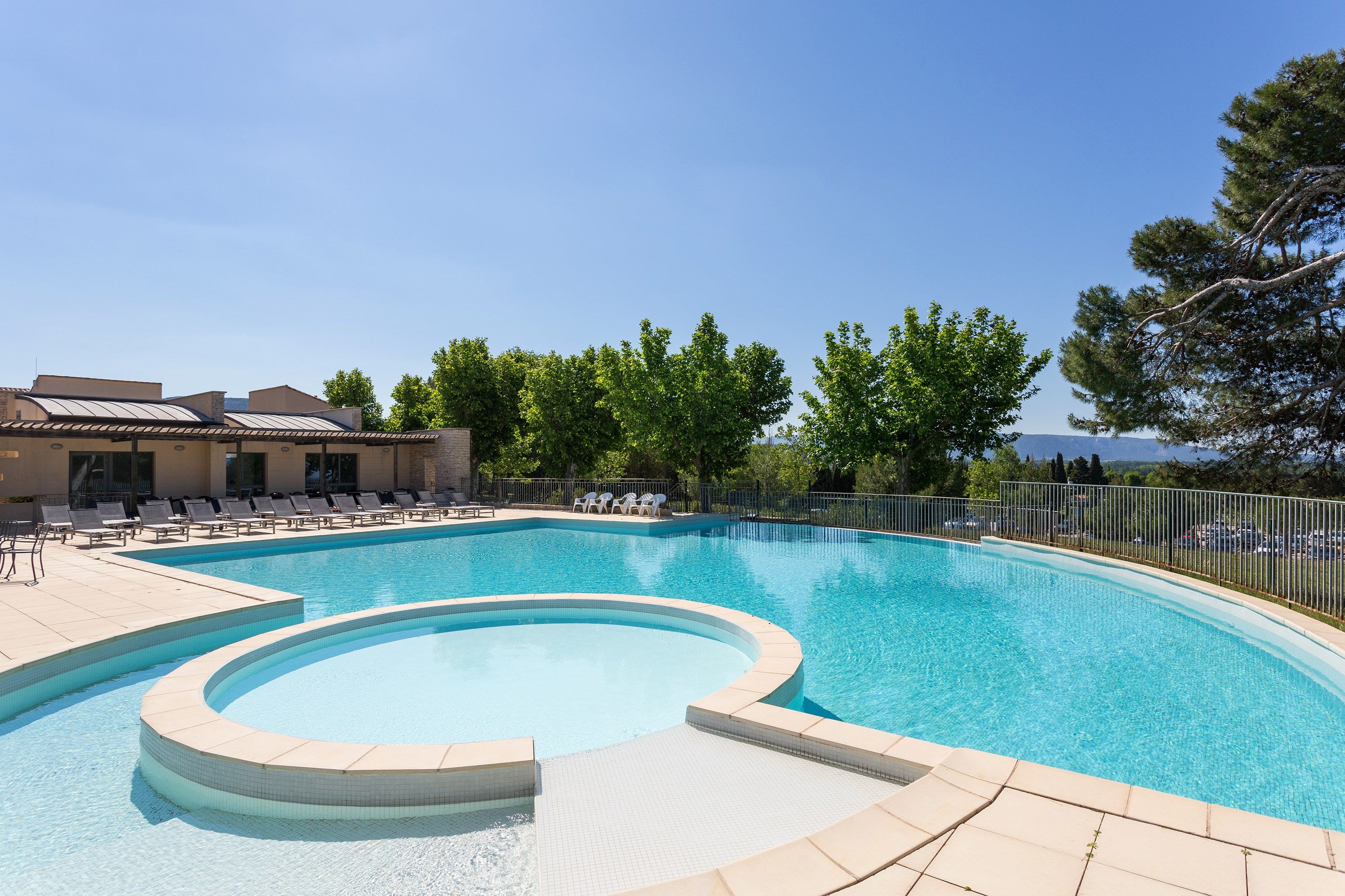 image Dive into the lovely seasonal outdoor pool during the summer.