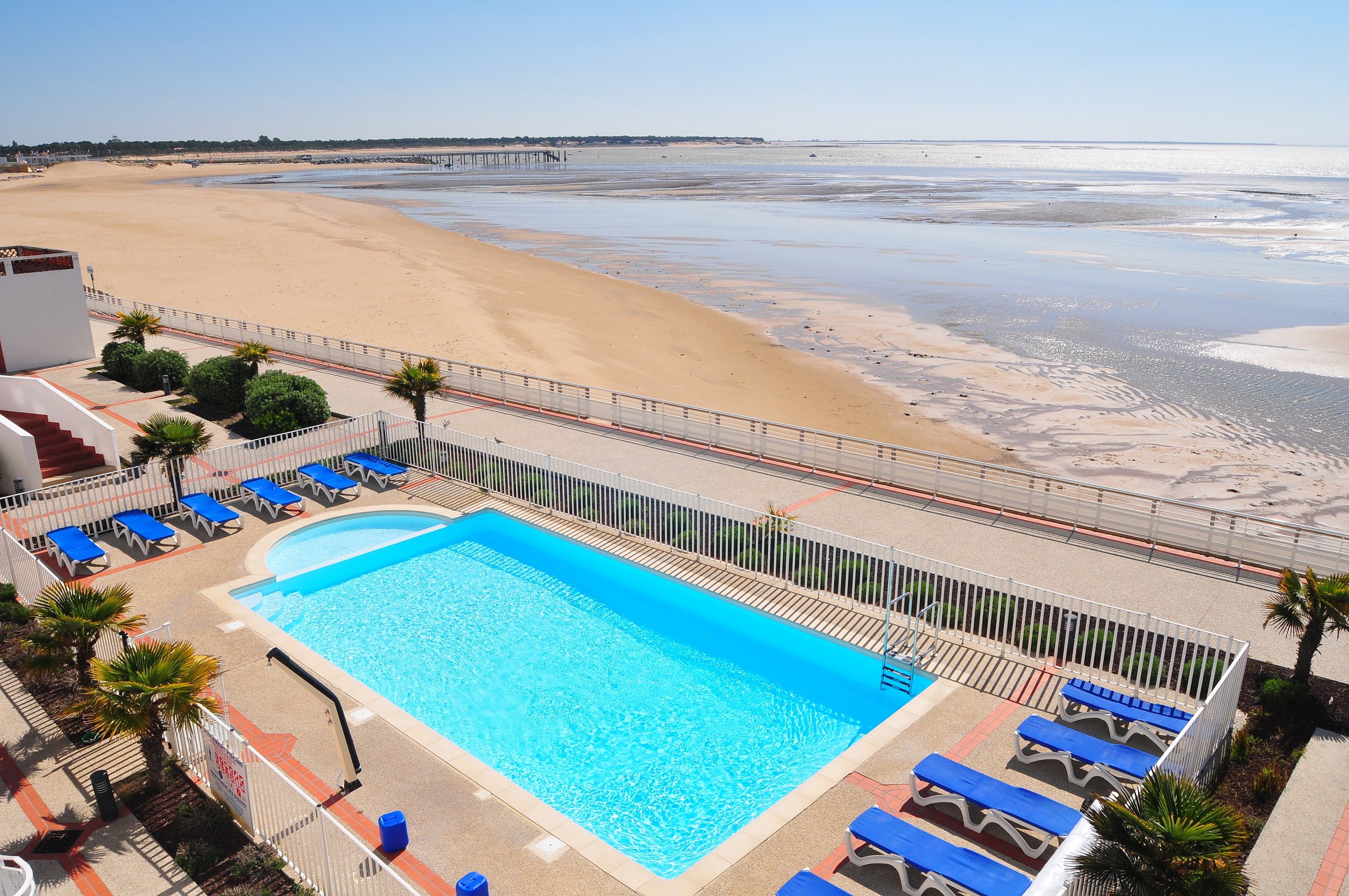 image Dive into the gorgeous outdoor pool on a hot summer day.