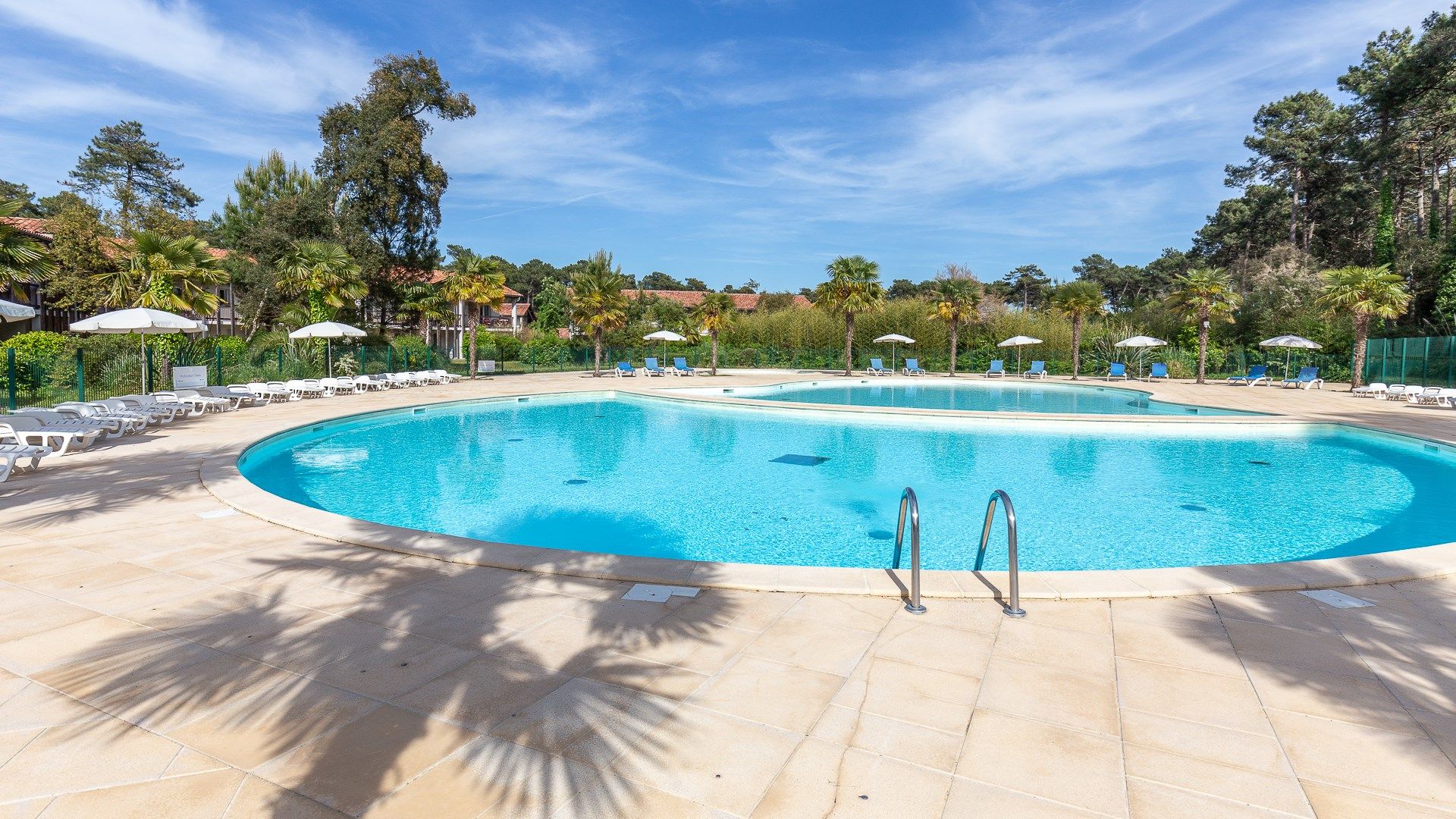 image Lounge by the pool in the sunshine.Take a dip in the outdoor pool.