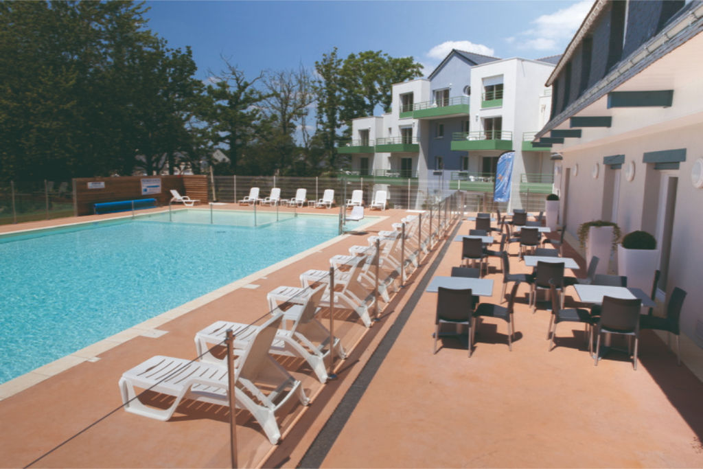 image Lounge by the pool in the sunshine and take a dip in the outdoor pool.