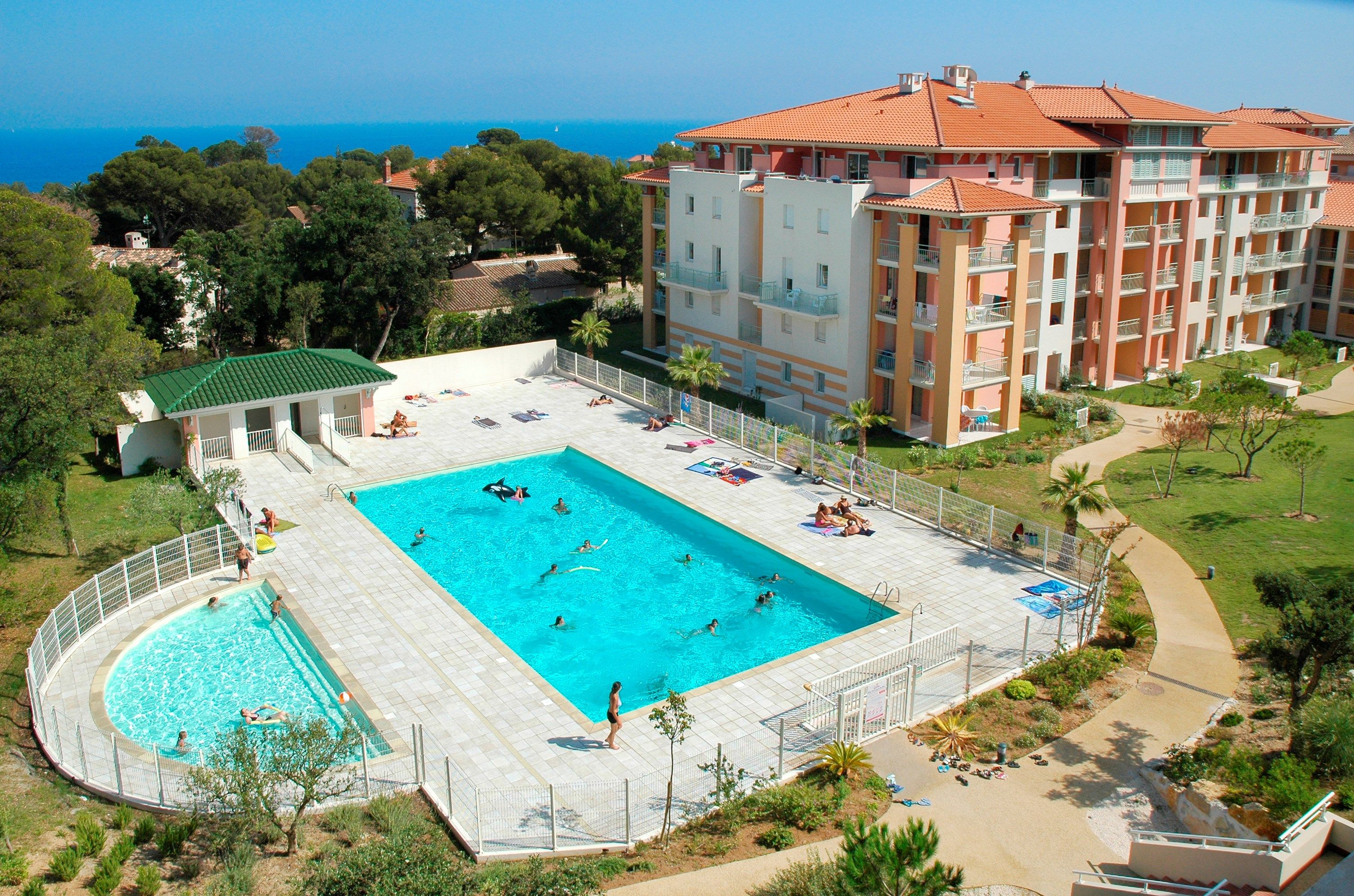 image Dive into the gorgeous outdoor pool on a hot summer day.