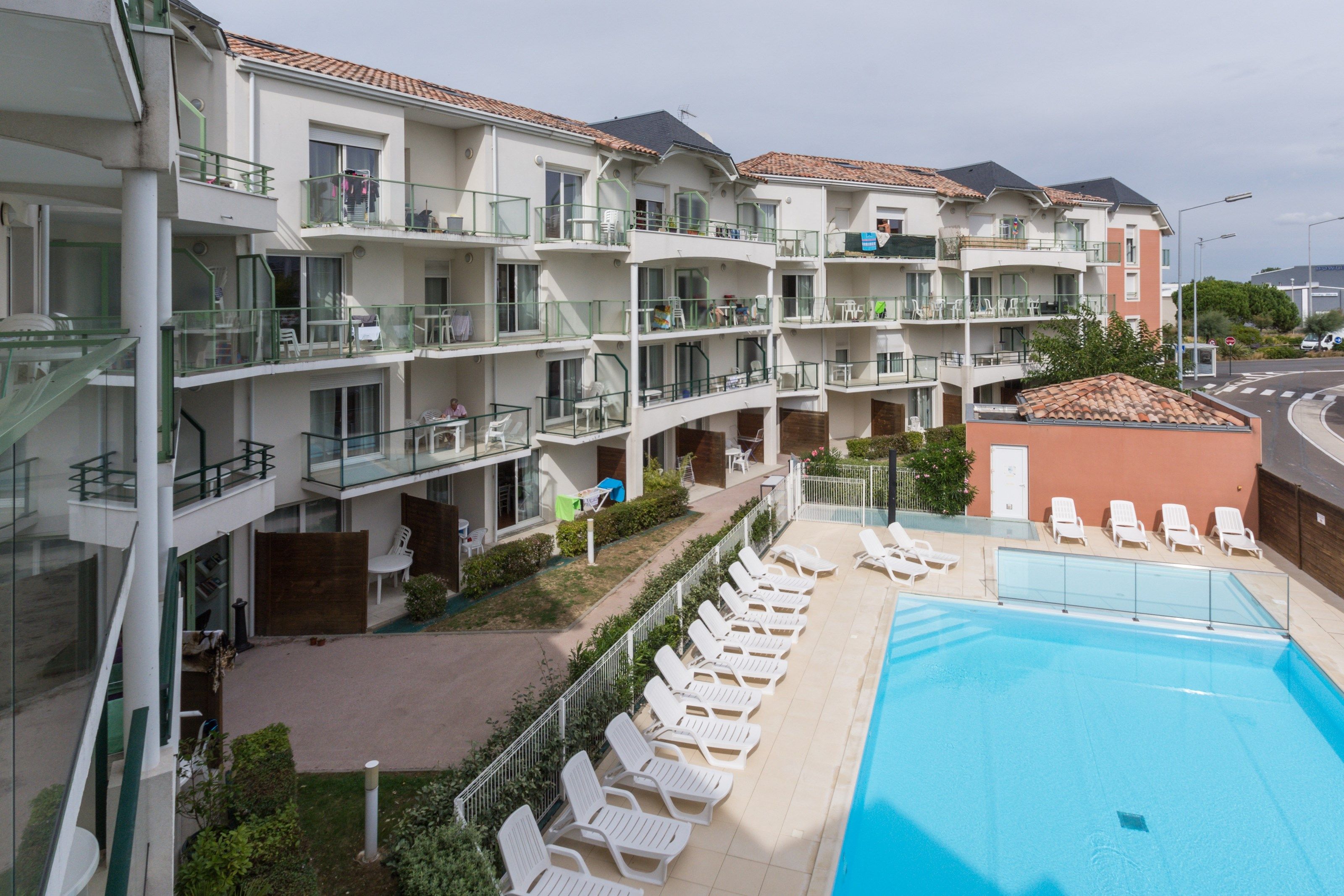 image Dive into the gorgeous outdoor pool on a hot summer day.