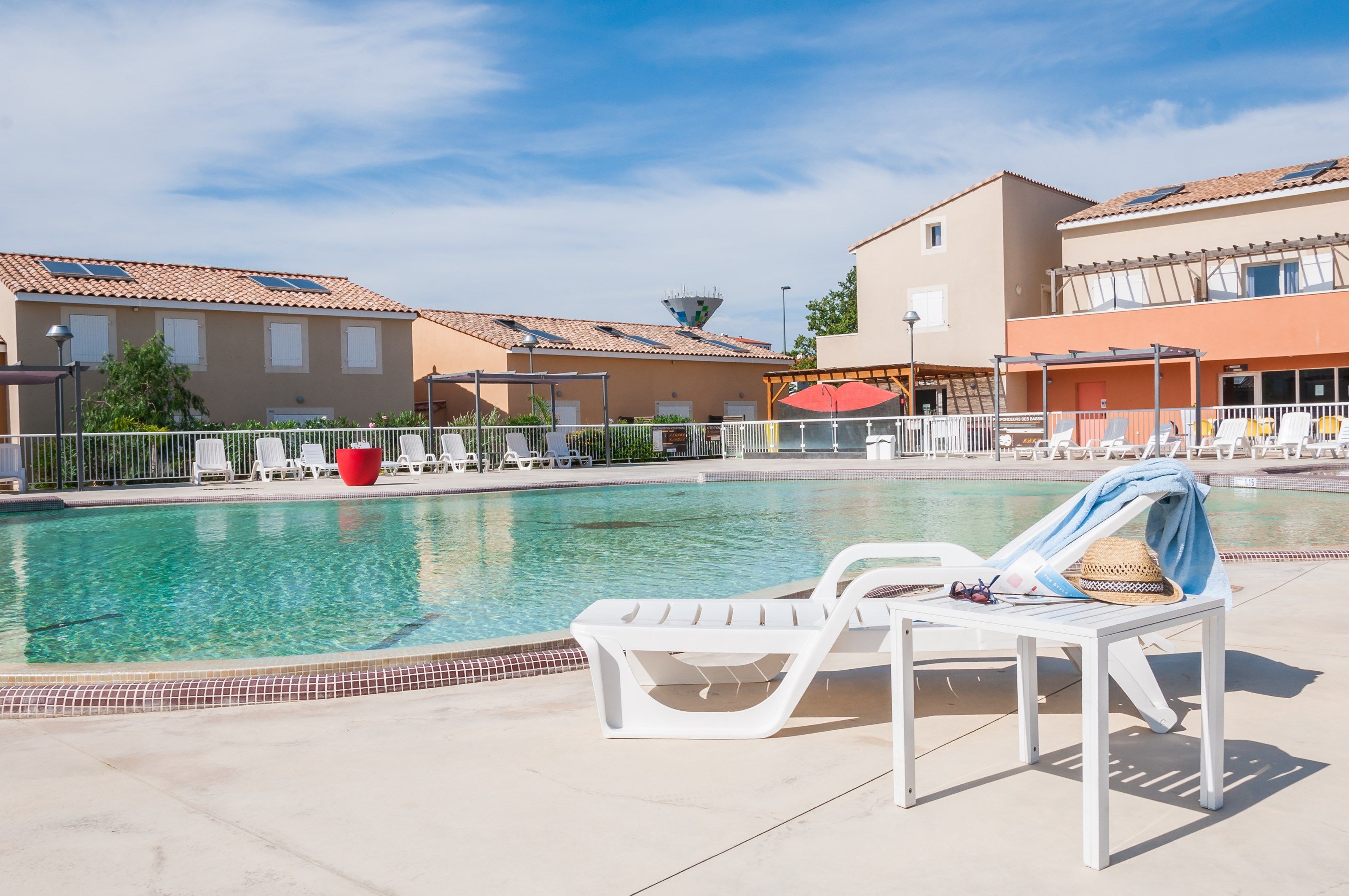 image Dive into the gorgeous outdoor pool on a hot summer day.