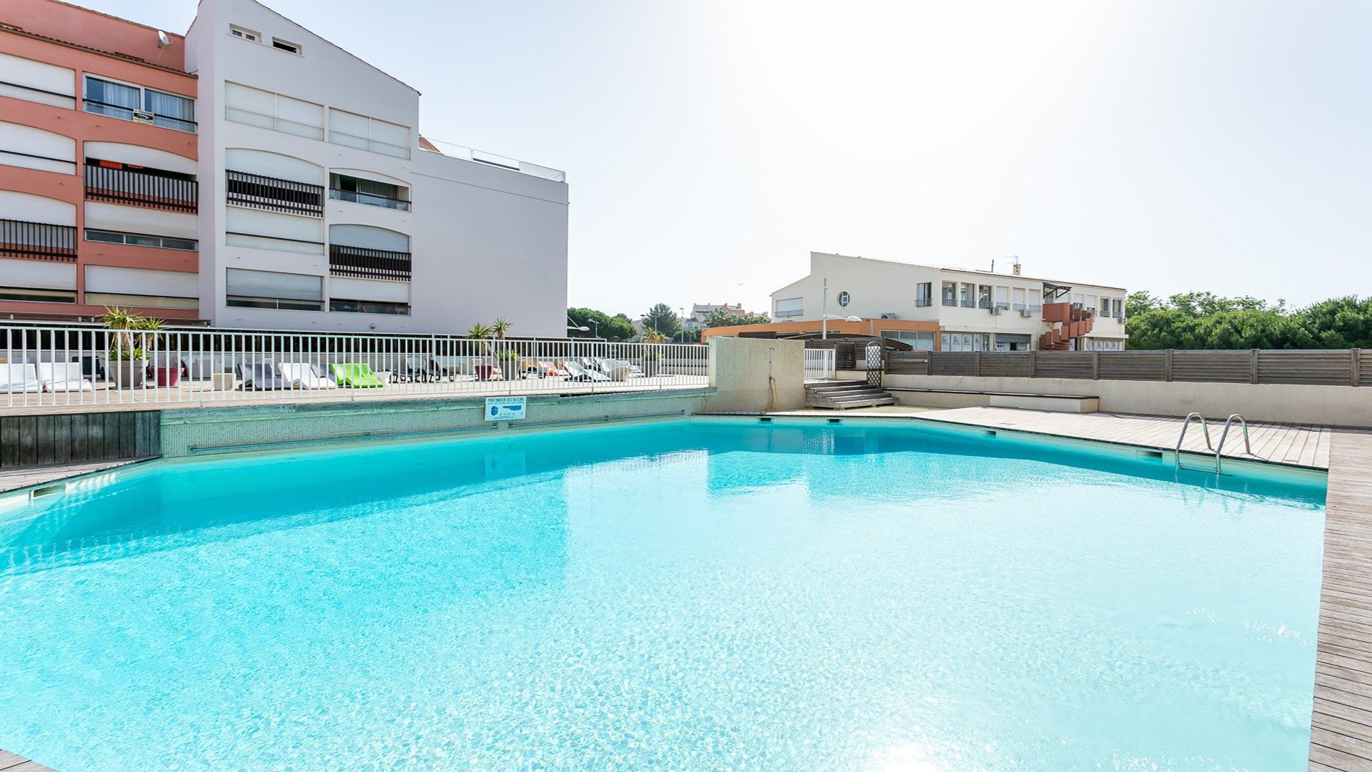 image Dive into the lovely outdoor pool during the summer.