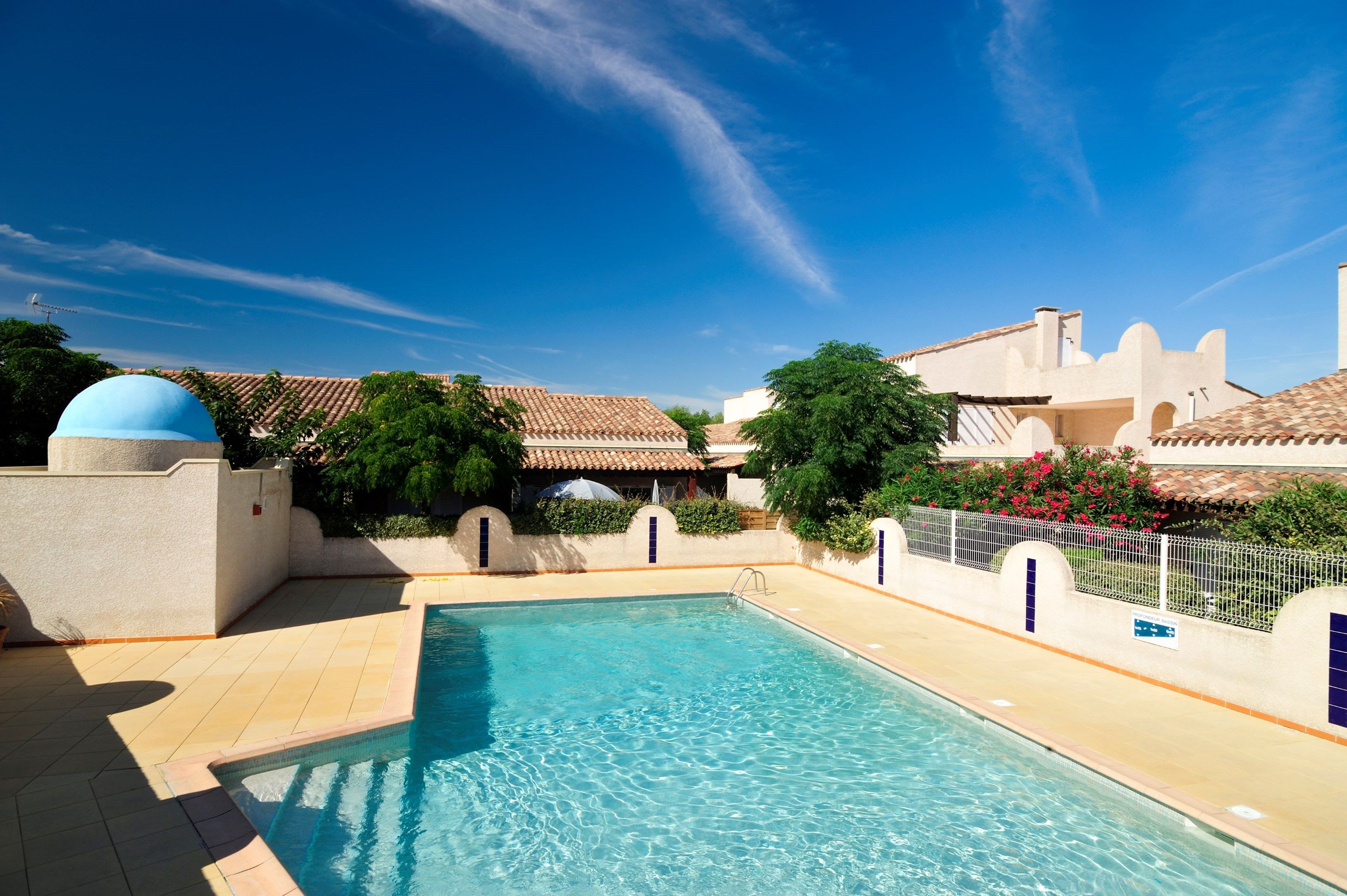 image Dive into the gorgeous outdoor pool on a hot summer day. - Please note that the pool is closed until further notice due to COVID-19