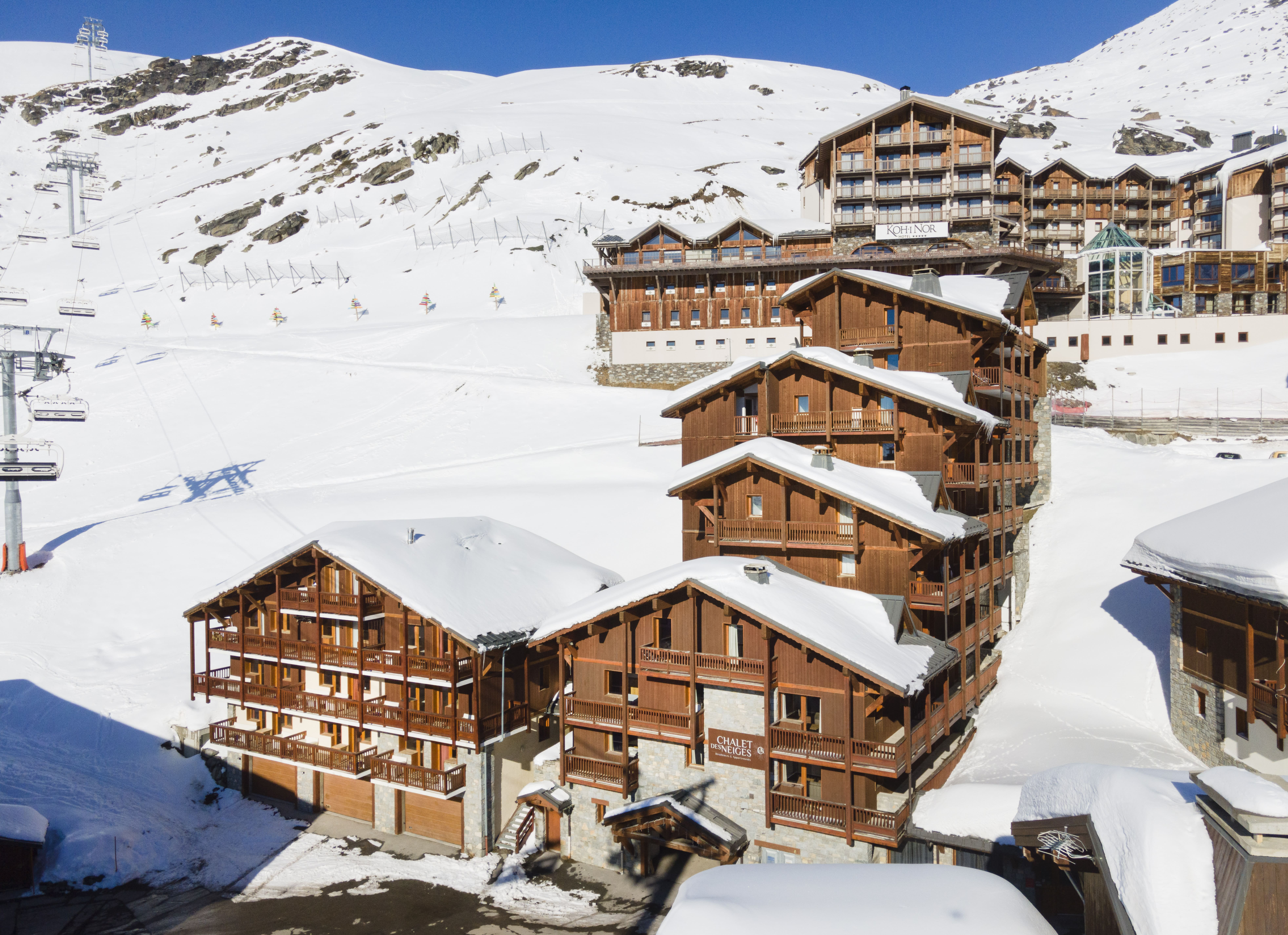 image Wooden chalet style with the ski lift right nearby.