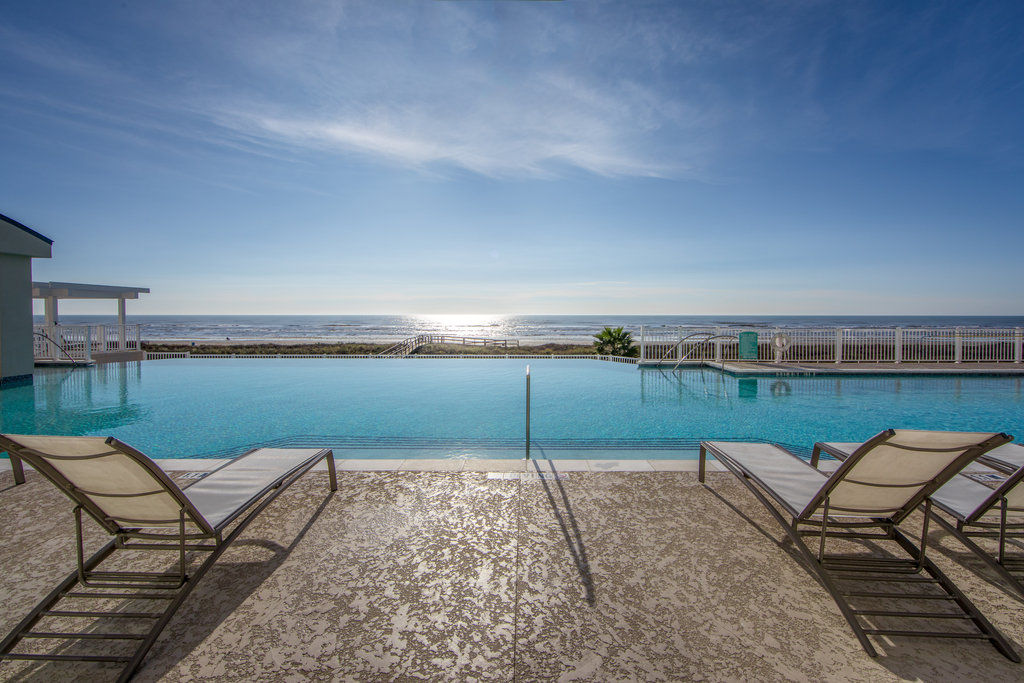 image Take a refreshing dip in the infinity pool as the sun dances on the ocean waves.